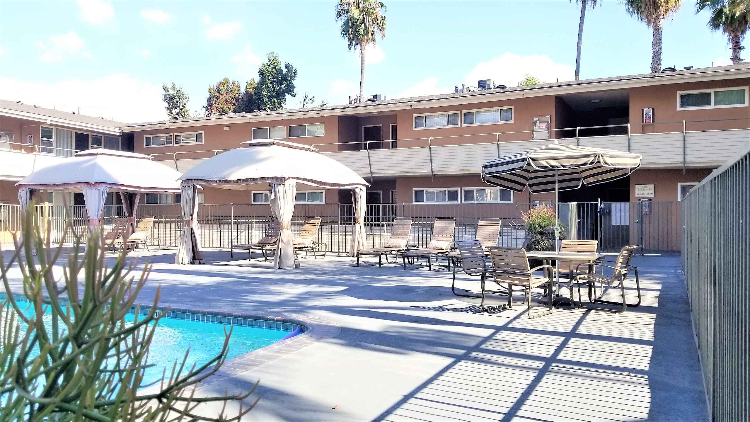 community pool chairs lounge area at Terraces