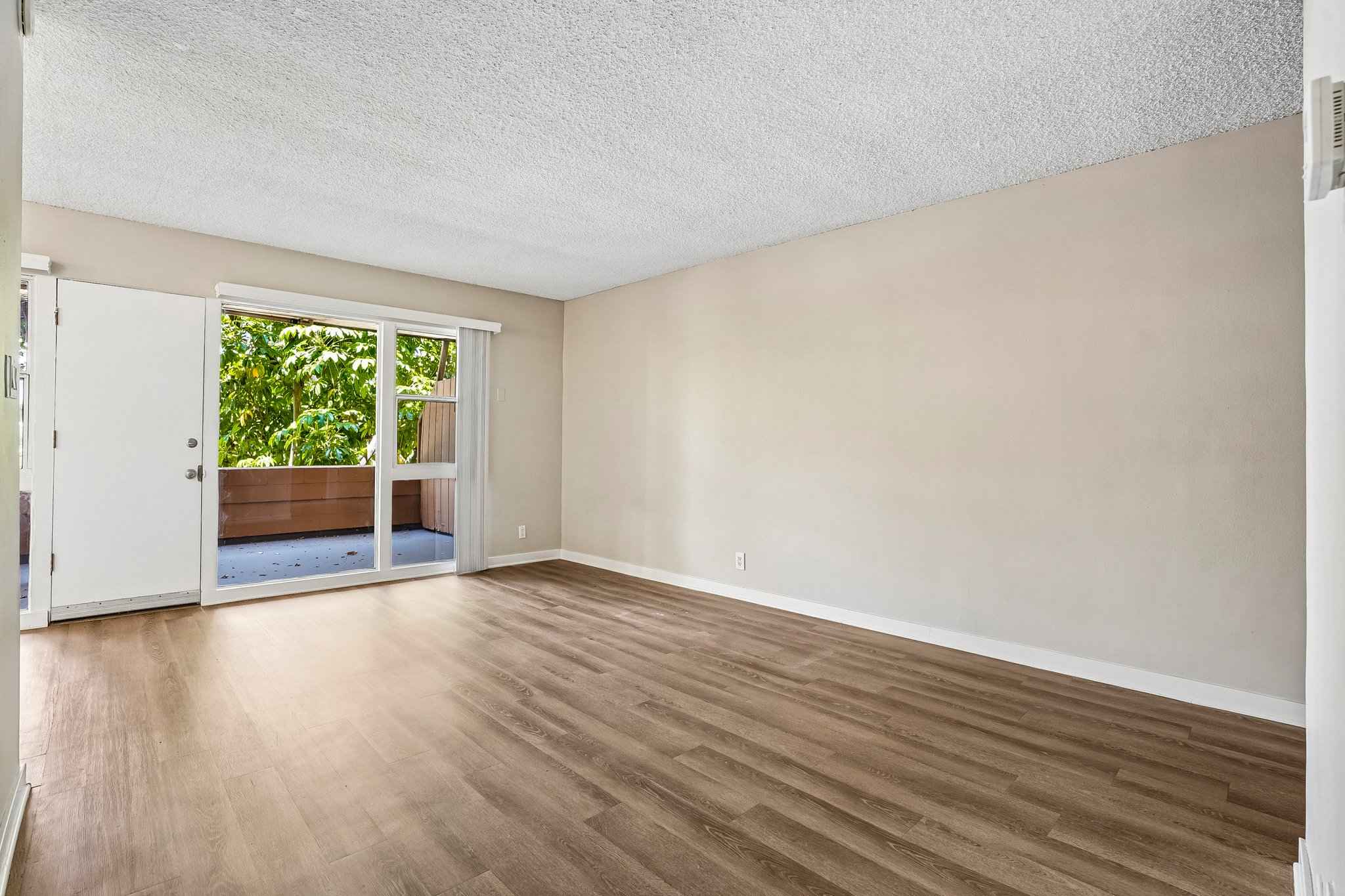 living room patio slider entry at Terraces