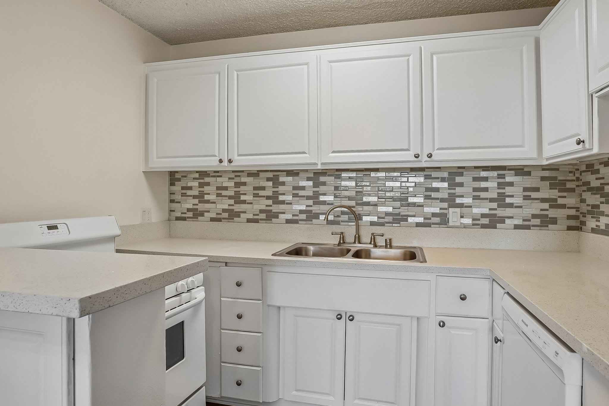 kitchen quartz counters tile backsplash at Terraces