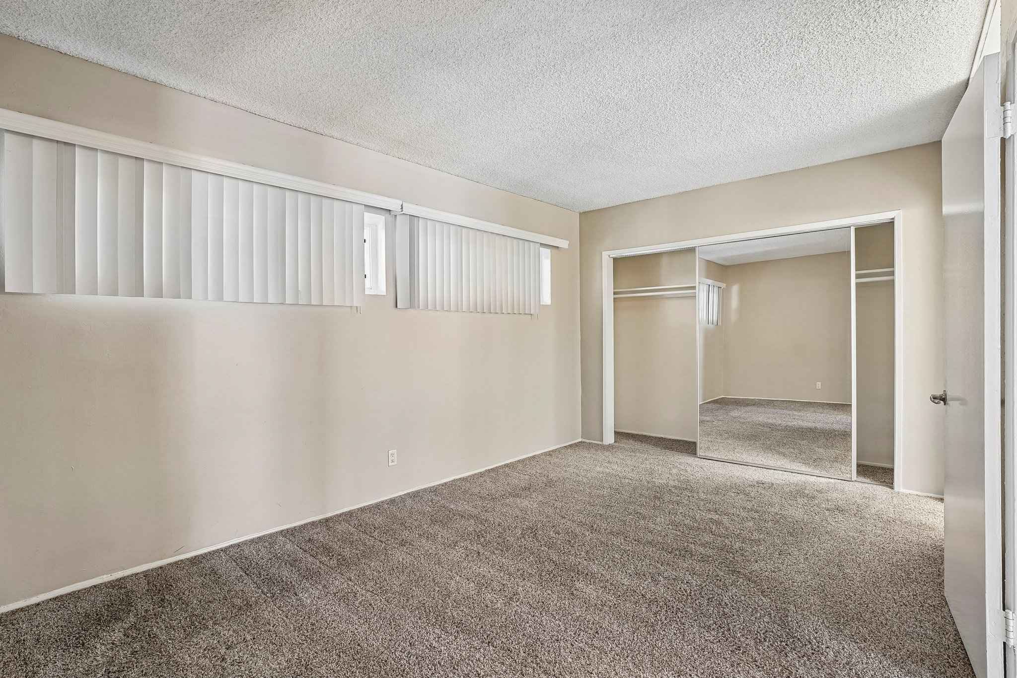 bedroom mirrored closet carpet at Terraces