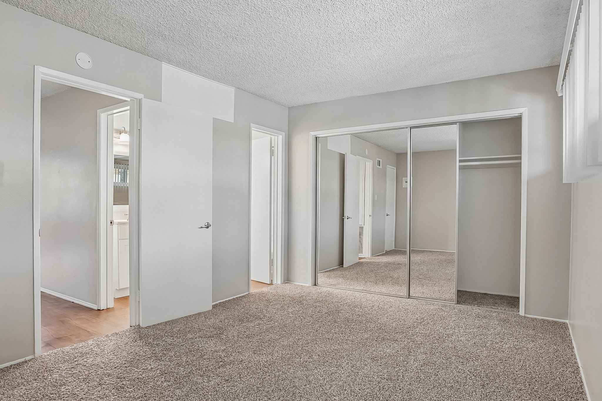 bedroom mirrored closet ensuite at Terraces