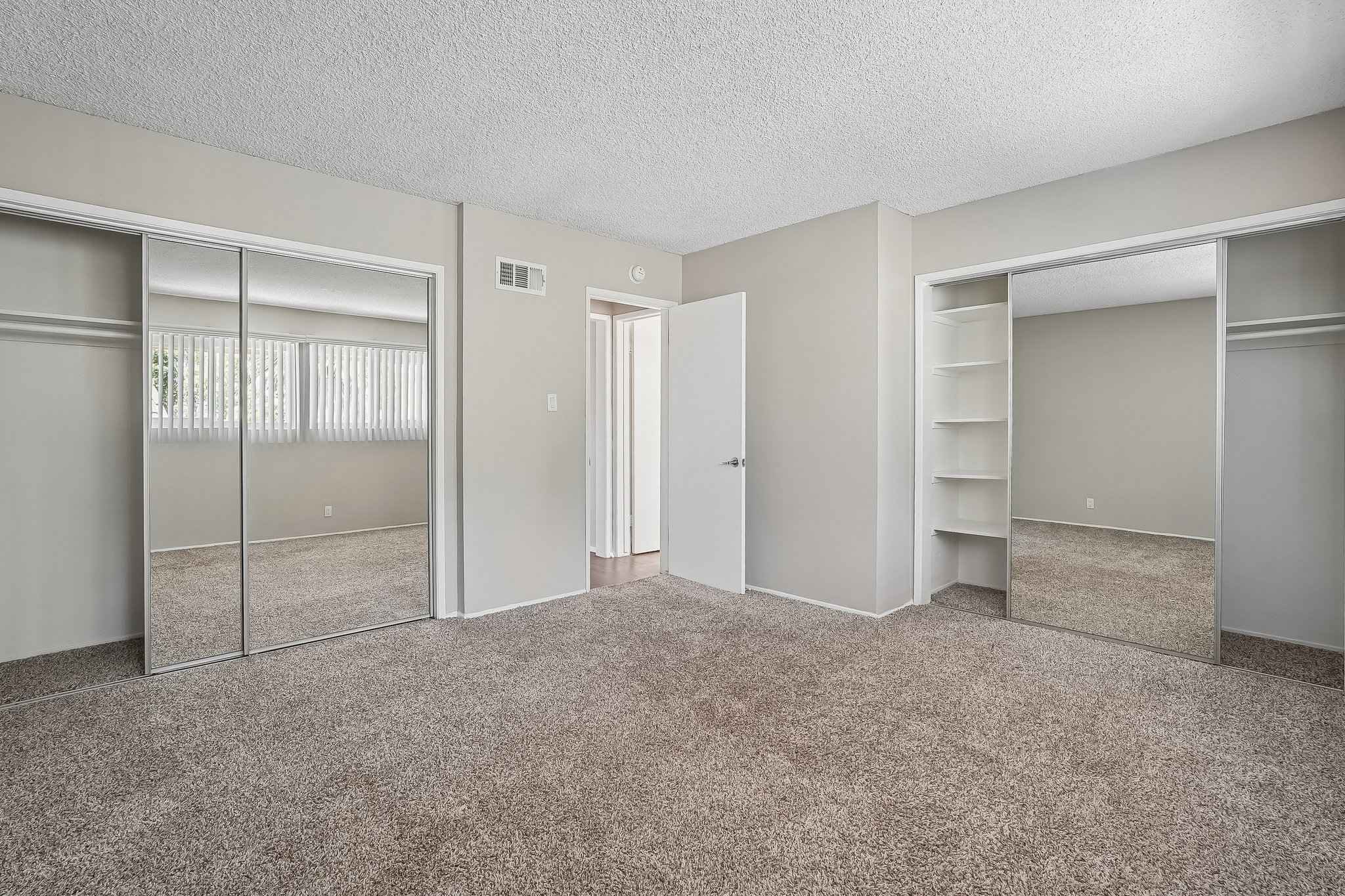 bedroom dual mirrored closets shelving at Terraces